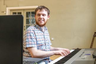 Daniel Barker teaching a piano student online with Your Space Music Lessons