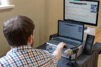 Dan Barker teaching a piano lesson online