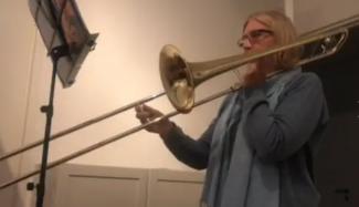 an adult learning to play the trombone with Your Space Music Lessons