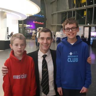 Online brass teacher Chris Robertson with pupils