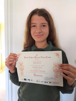 Julia with accordion certificate