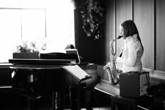 Lucy Leibold playing the saxophone